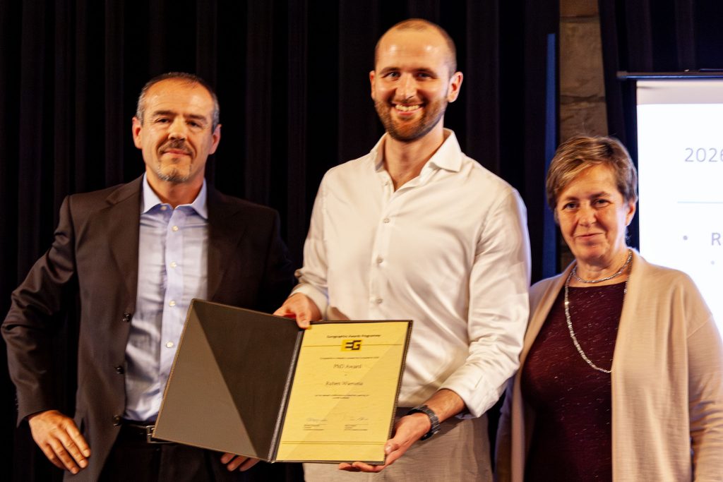 Photo from the EG 2026 award ceremony showing Ruben Wiersma receiving the Eurographics PhD Award