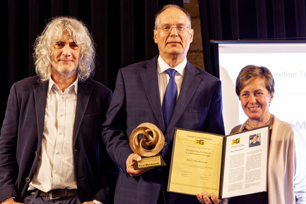Photo from the EG 2026 award ceremony showing Karol Myszkowski receiving the EG Outstanding Technical Contributions Award