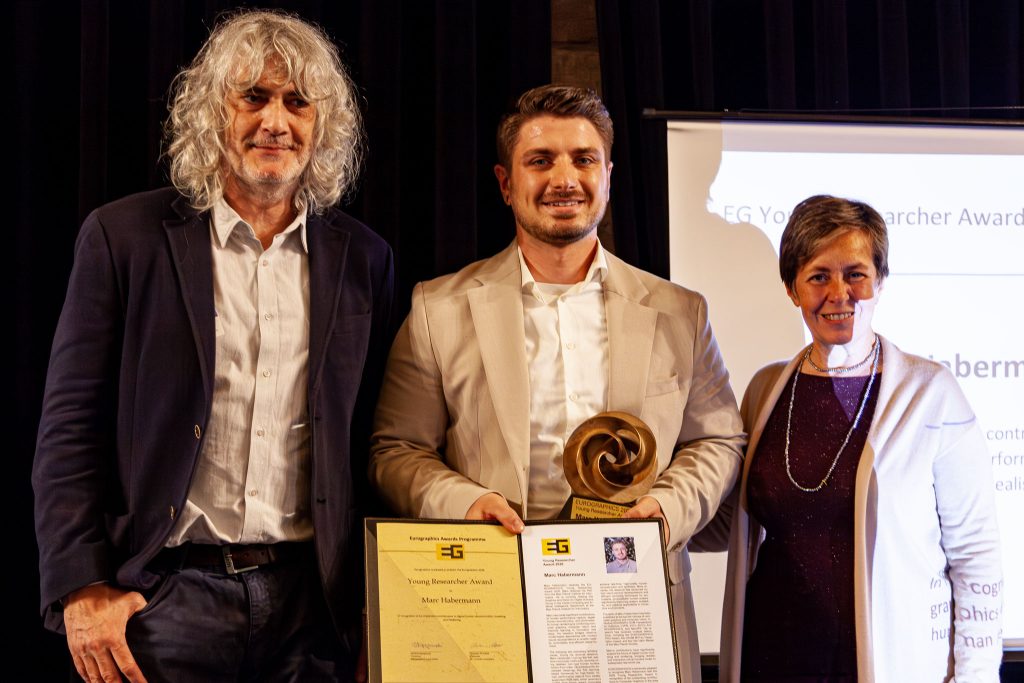 Photo from the EG 2026 award ceremony showing Marc Habermann receiving the EG Young Researcher Award